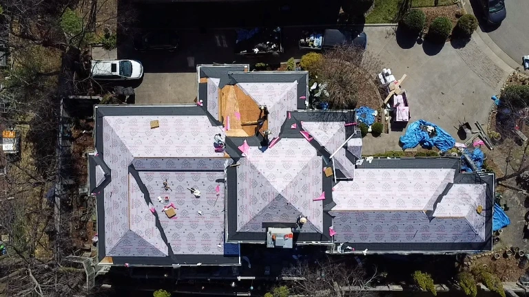 White Glove Roofing team performing a residential roofing installation in Midfield, AL